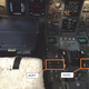 An image from the AAIB report shows the two audio control panels (ACP) that were damaged in the spill